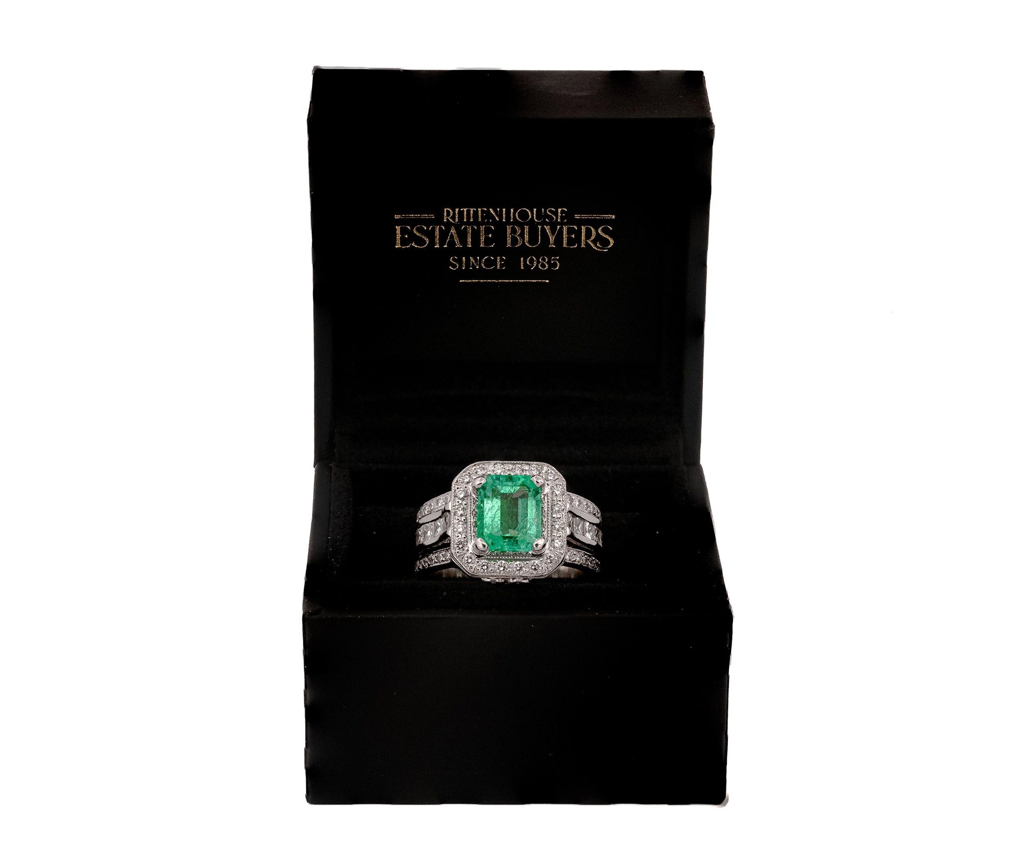 Platinum 2.06ct Emerald and 1.18ct Diamond Halo Ring