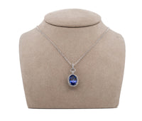 18K White Gold 4.81ct. Tanzanite & .35 cttw. Diamond Halo Style Pendant Necklace