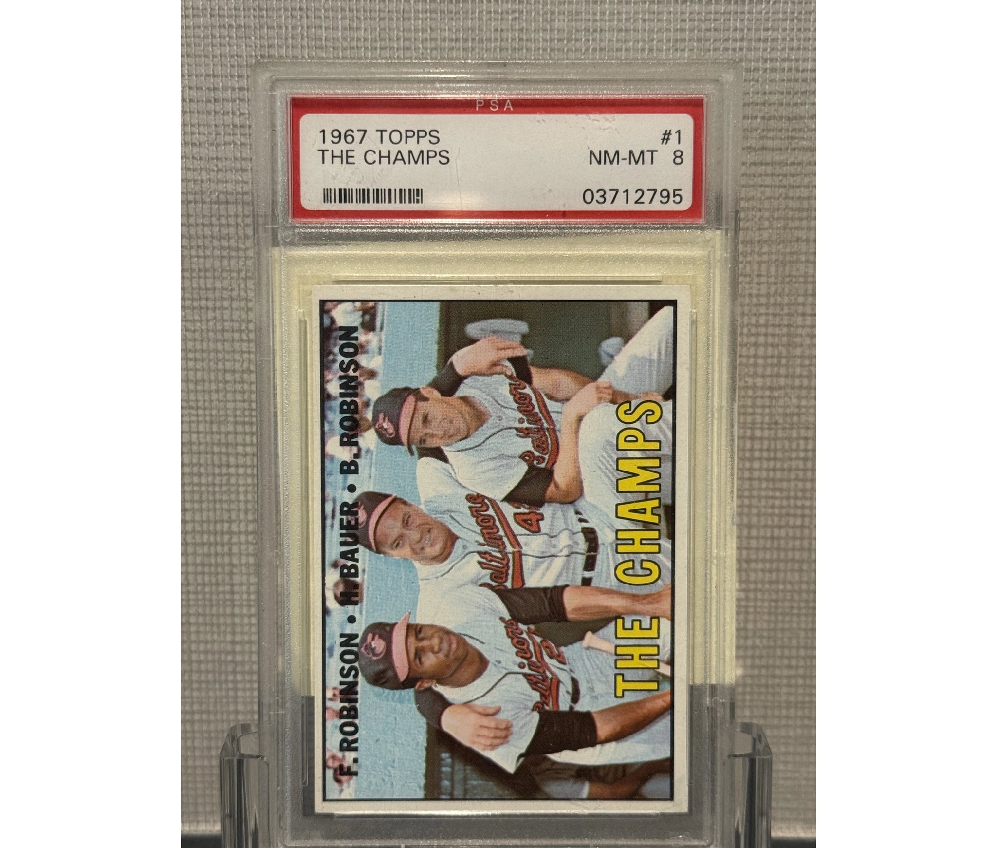 1967 Topps "The Champs" Frank Robinson/Brooks Robinson/Hank Bauer PSA 8